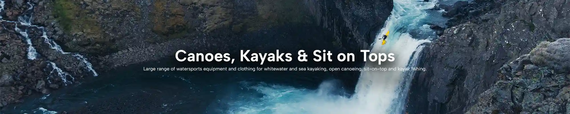Man kayaking down a waterfall.